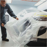 Indasa Cover Roll HDPE Masking Film, technician applying sheeting over a car
