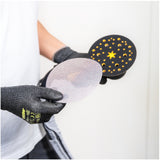 Person applying Mirka Abranet sanding disc onto a Mirka sander tool, on a white background