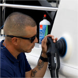 Person using a polisher on a yacht with a bottle of RUPES XP-700 product in the background.