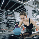 Sandwox 818 Series Blue Net 6" Mesh Grip Sanding Discs, female technician with a tank top and safety goggles sanding a car hood in a body shop