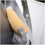 Sunmight Gold Soft Flex Foam Hand Sanding Pads being used to sand a car panel