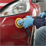 Person using a polisher on a red car with Surf-ACE compound