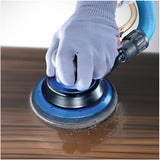 Sia 7940 siaair Velvet 6" Foam Polishing Grip Discs being used on a varnished wood surface